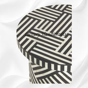 Black round side table with optical bone inlay design