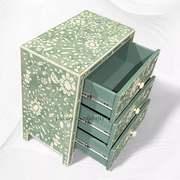 Stylish green resin bedside table with bone inlay detail