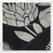 Luxury black bar cabinet with geometric bone inlay pattern